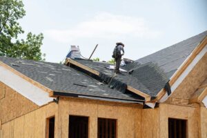 Light-colored reflective roof on a suburban home under bright summer sunlight