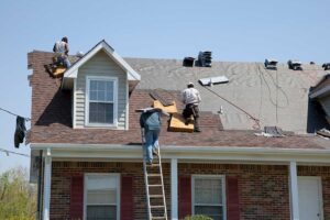 Uneven shingles, exposed fasteners, and damaged flashing visible on a residential roof.